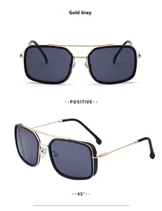 Detail view of square aviator sunglasses in gold and grey with spring hinges