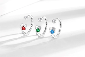 Close-up of heart gemstone ring band featuring 'I love you forever' engraving inside