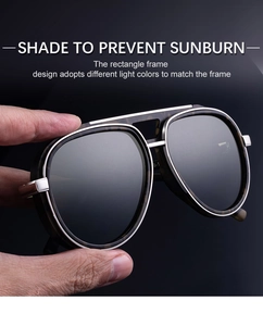 Detail of retro pilot sunglasses with dark tortoiseshell pattern and double bridge frame