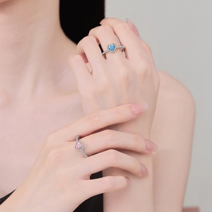 Elegant adjustable heart ring with blue and pink cubic zirconia and pavé diamond setting