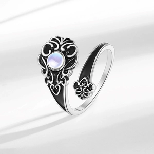 Vintage silver open ring with blue moonstone and gothic fleur-de-lis engravings
