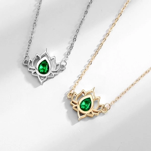 Elegant gold and silver lotus flower pendant necklaces with emerald green teardrop crystals