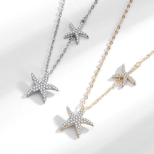Collier double étoile de mer élégant en or et argent avec des strass étincelants
