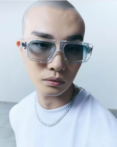 Detail of square transparent sunglasses with blue gradient lenses on male model