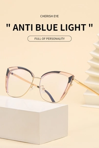 Detailed view of cat-eye anti-blue light glasses with gold metal frame and color patches