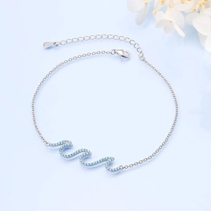 Elegant wave-shaped S925 sterling silver bracelet with sparkling light blue zircon stones