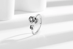 Macro shot of vintage silver ring with detailed skull and octopus tentacle design