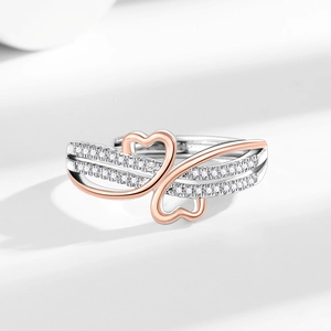 Two-tone heart-shaped interlocking open ring with sparkling cubic zirconia settings
