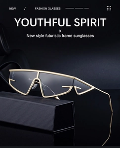 Golden punk sunglasses with dark lenses resting on a triangular case with reflections