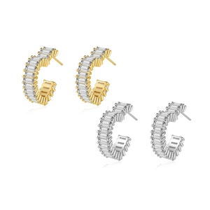 Elegant C-shaped baguette-cut zirconia hoop earrings in gold and silver finishes