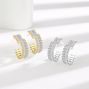Modern C-shaped hollow heart earrings with baguette-cut pavé zircons in gold and silver