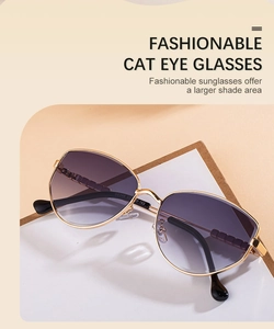 Close-up of golden metal cat eye sunglasses with gradient purple lenses and temple details