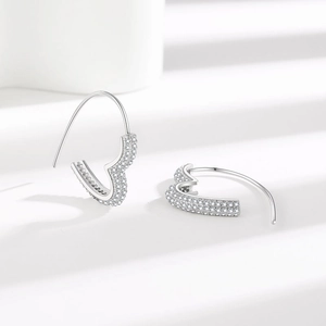 Sparkling silver heart hook earrings with micro-pave crystals in a minimalist design