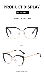Detailed view of cat eye optical glasses in black and golden frame with metallic nose pads
