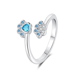 Silver adjustable paw print ring featuring blue heart-shaped cubic zirconia and crystals
