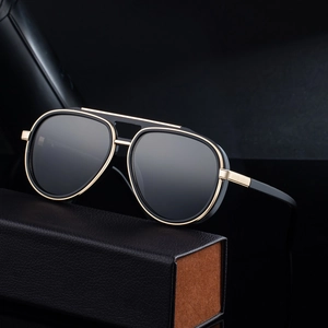 Classic aviator sunglasses with black lenses and gold frame, including a leather storage case