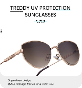 Detail of gold metal sunglasses frame with dice-embossed temples and UV lenses
