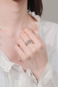 Detail of silver butterfly fidget ring with spinning beads and sparkling zircon stones