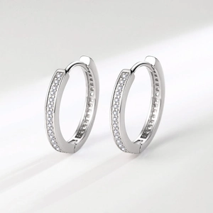 Classic silver huggie hoop earrings with sparkling pave-set white crystals for women