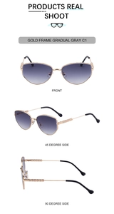 Detail view of gold cat-eye sunglasses with gradient lenses and embossed pattern