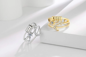 Close-up of spinning beads and star-moon details on rotating anti-anxiety rings