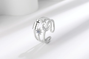 Macro detail of adjustable star and moon spinner ring with anxiety relief rotating beads