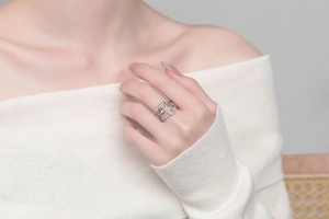 Detail of adjustable silver star and moon ring with crystals worn on a finger