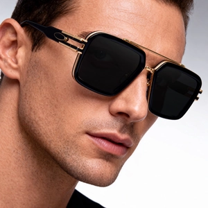 Detail of square frame sunglasses for men with golden double bridge and black frame
