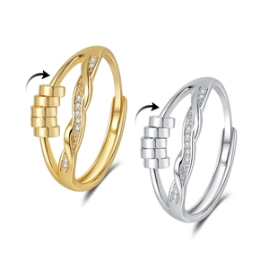 Fidget spinner rings set in gold and silver finish with zircon accents for anxiety relief