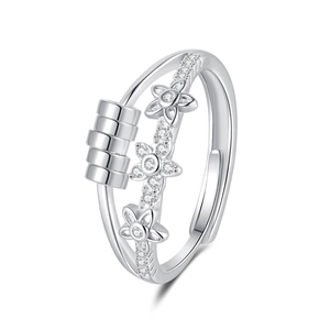 Rotating anxiety ring with silver flower design and sliding beads on adjustable open band