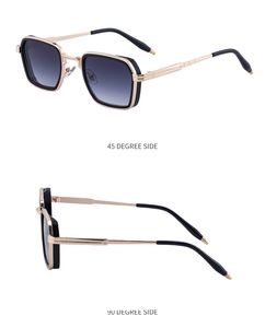 Détail des lunettes punk carrées avec branches en métal doré et verres dégradés