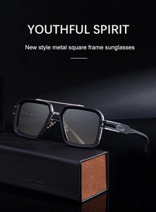 Detail of square vintage sunglasses with silver metal temples on a leather case