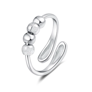 Adjustable silver spinner ring with four sliding beads featuring matte and polished finishes