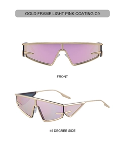 Close-up of futuristic cat eye sunglasses with gold metal frame and pink tinted lenses