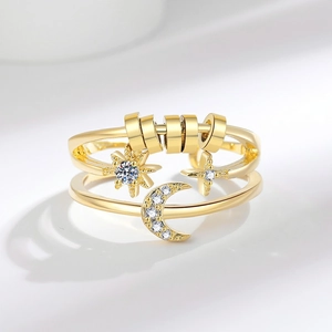 Adjustable gold star and moon fidget ring with sparkling cubic zirconia and spinning beads