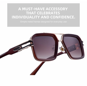 Detail of square vintage sunglasses showing the golden metal bridge and brown gradient lens