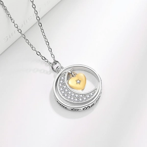 Silver crescent moon and gold heart necklace with you to the moon engraving on white