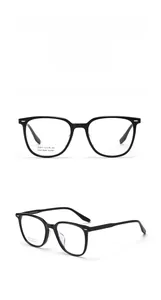 Close-up of black handmade acetate glasses frames with silver rivet detail and model J20013