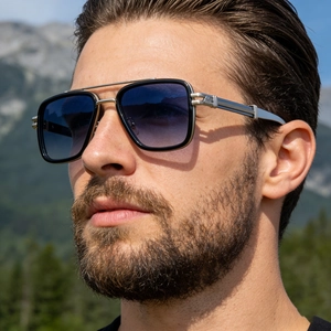 Detail of square frame sunglasses featuring a double bridge and silver metal temple decor