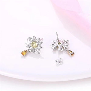 S925 silver daisy earrings with yellow zircons and teardrop pendants in white background