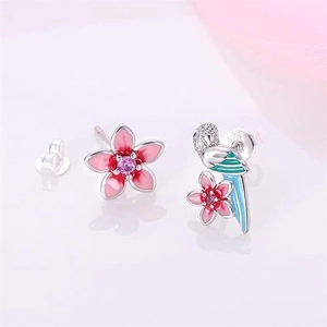 Asymmetric S925 silver studs featuring pink cherry blossoms and a blue bird bird charm
