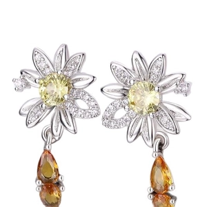 Daisy flower earrings with white zircon petals and orange teardrop crystal pendant