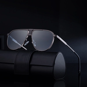 Classic pilot sunglasses with dark metal frame and black lenses on leather case