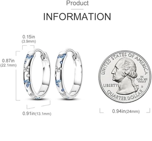 Dimensions des créoles papillon avec une pièce de 25 cents pour comparer la taille