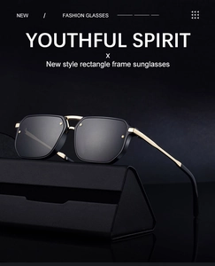 Rectangle sunglasses with gold metal frame resting on a black triangular glasses case