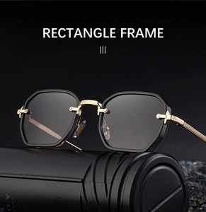 Detail of square black frame sunglasses with golden metal hinges and industrial rivets