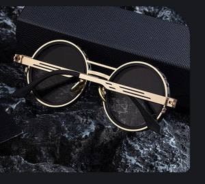 Macro shot of gold steampunk metal frame detail and 62mm sizing on round sunglasses