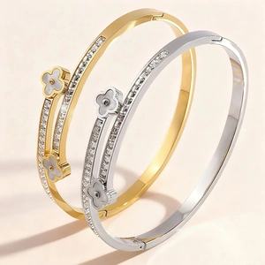 Stainless steel clover bangles in gold and silver finish with sparkling pavé crystals