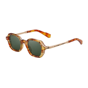 Vintage tortoiseshell polarized sunglasses with gold engraved metal temples on white background