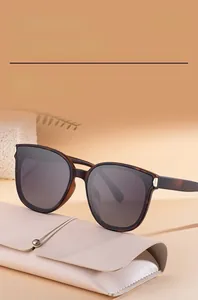 Detail of square polarized sunglasses with tortoiseshell frame and pink leather case